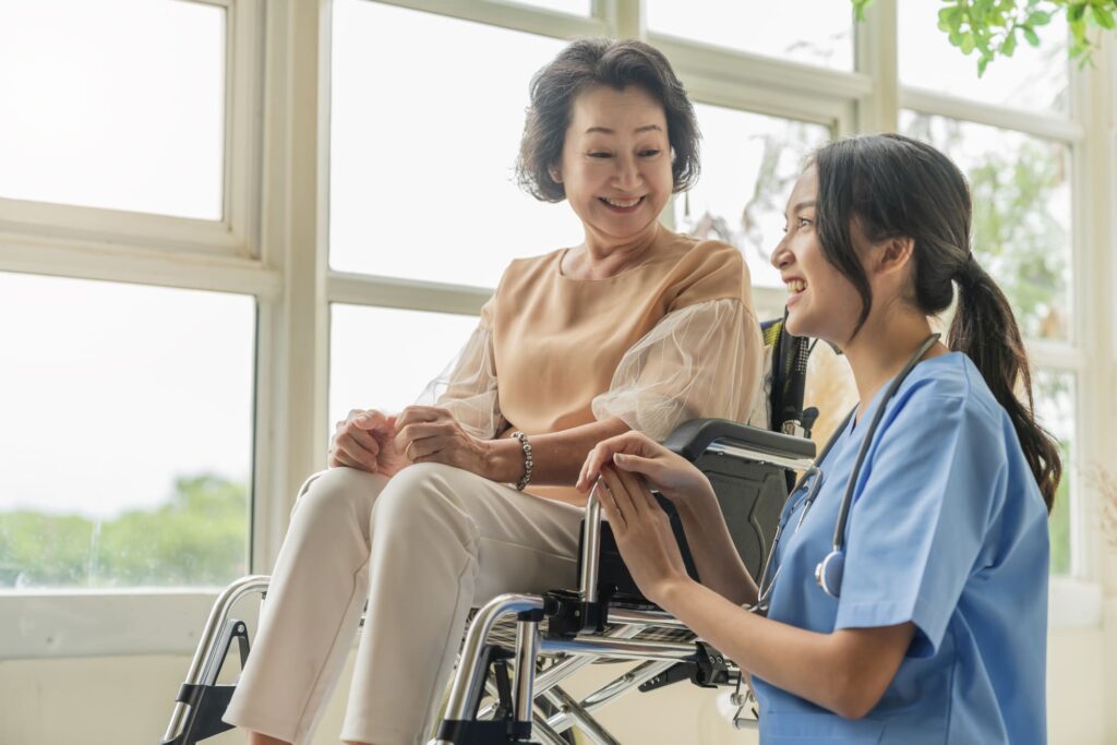 Caregiver assisting an older woman in a wheelchair with compassionate home care support in Cincinnati, OH